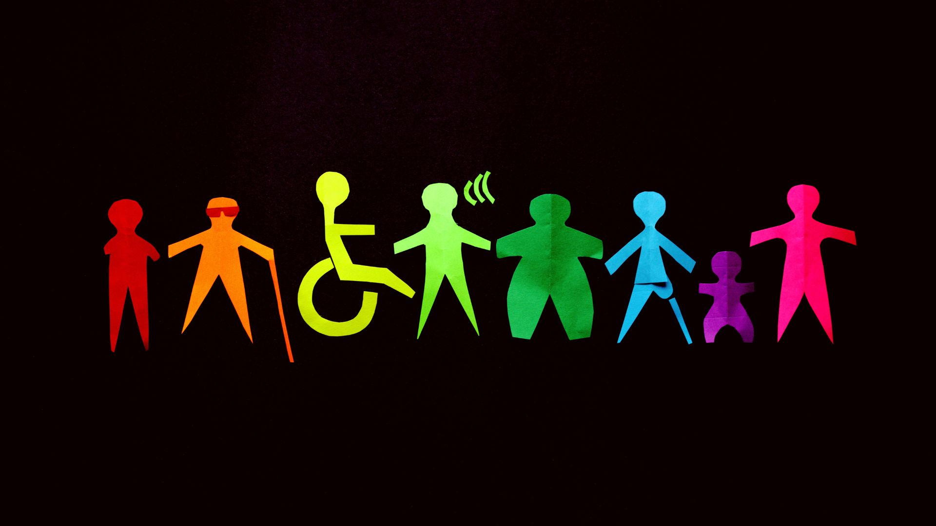 Immagini di omini stilizzati con disabilità differenti, con colori diversi su sfondo nero